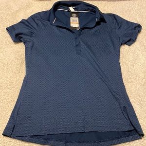 Never worn, NWT. Woman’s golf shirt